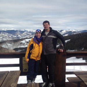 Kait Miller and Steven Miller skiing in the mountains